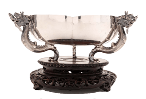 A chinese export silver bowl with dragon handles.